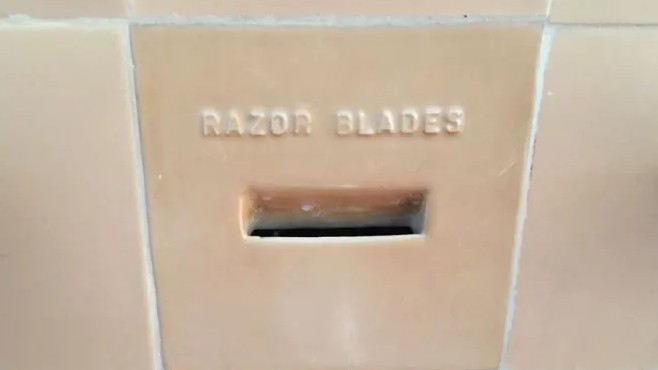 razor blade disposal wall